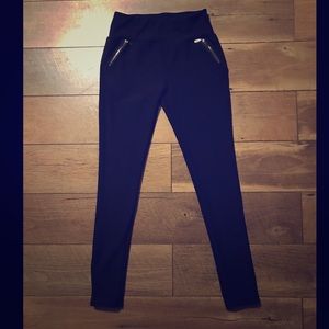 Spandex pants with gold zippers